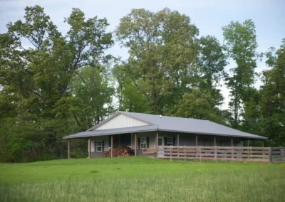 woodland-cabins-house-view-green-field